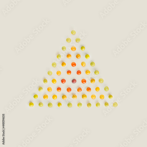 Canvas Print Color gradient made of wild plums concentric triangles isolated on pastel beige background