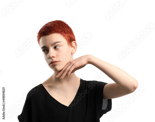 Portrait if non-binary teenager on white background photo