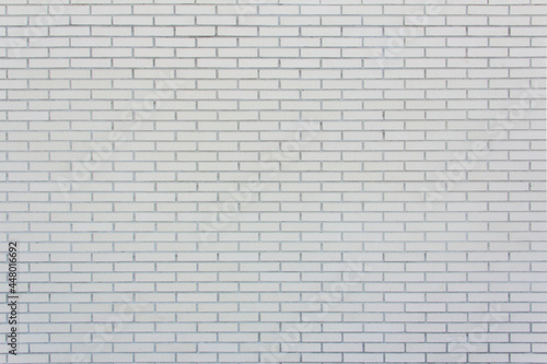 Small size lined white brick wall. Texture. Background.