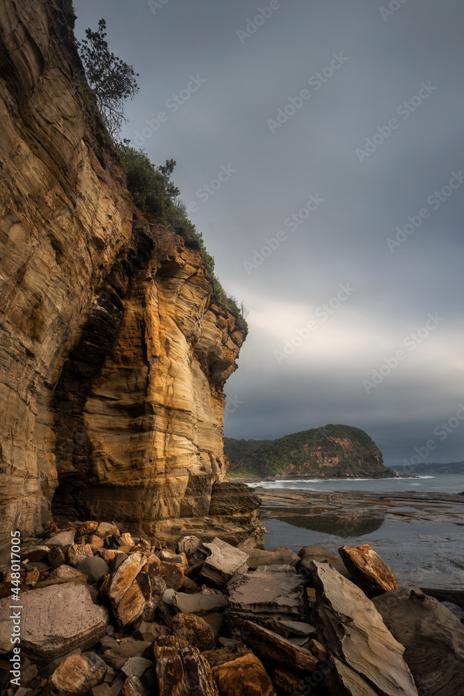 large rock face along the coastline