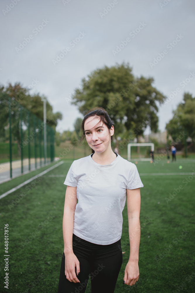Young caucasian woman portrait workout does the sports on the playground