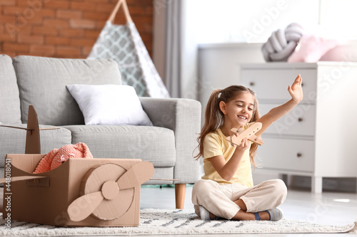 Little girl playing with to...