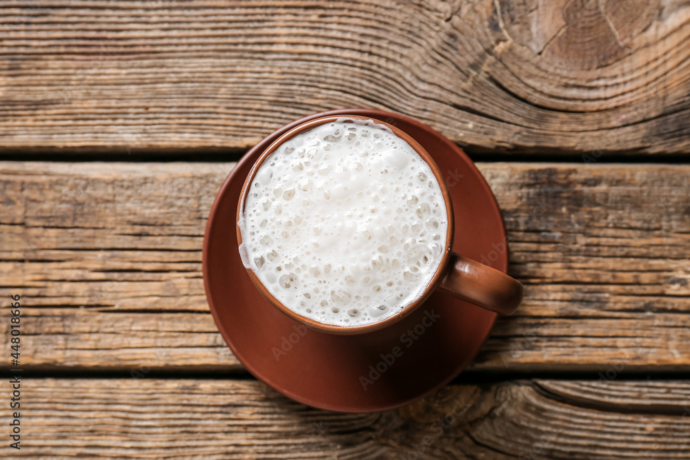 Cup of coffee on wooden background Cup of coffee on wooden background