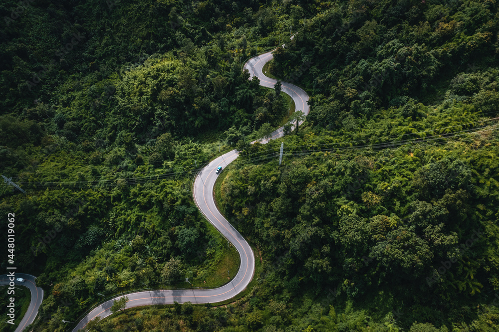 mountain road and green trees from above mountain road and green trees from above
