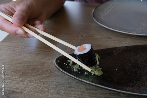 sushi in ceramic plate, close up photo