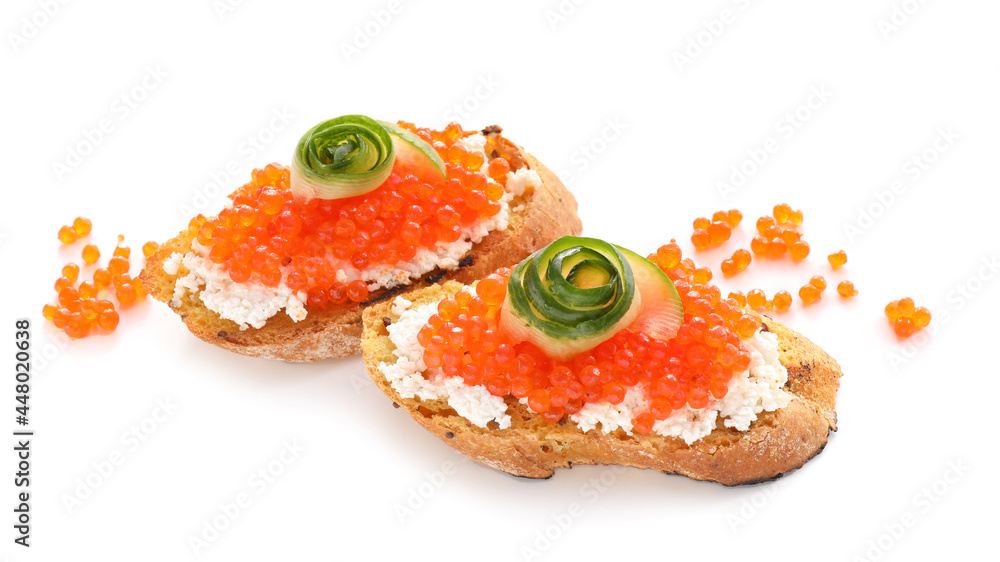 Tasty bruschettas with cheese, red caviar and cucumber on white background Tasty bruschettas with cheese, red caviar and cucumber on white background