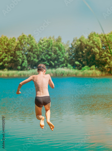 13 years Teenage boy swimming in lake, Children lifestyle. Enjoy the life