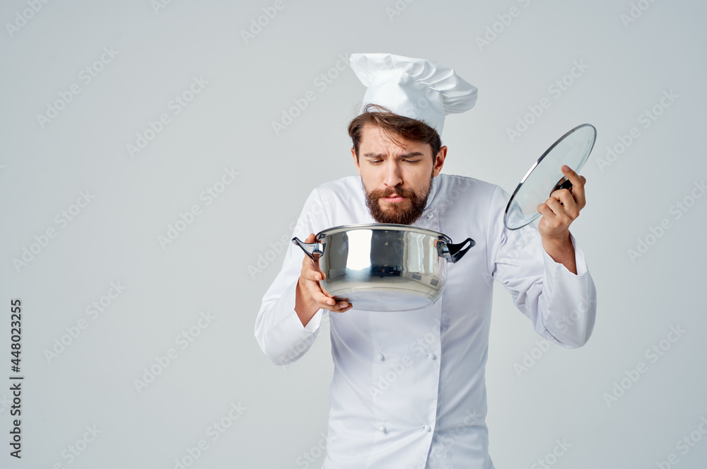 professional chef with pan in hand cooking food kitchen light background professional chef with pan in hand cooking food kitchen light background
