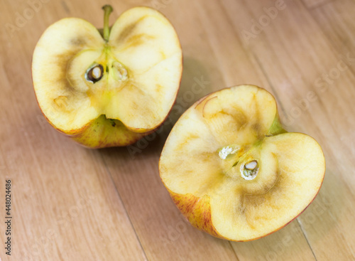 Slice of withered apple on a table. Selective focus.