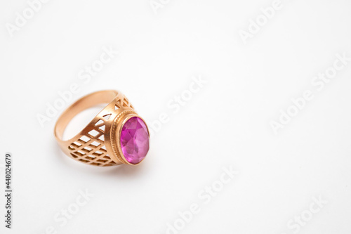 Gold ring with ruby isolated on white background