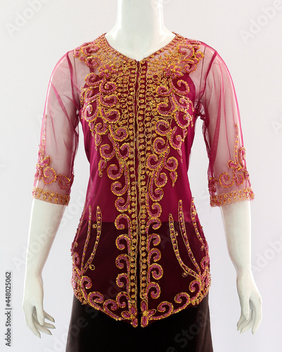 Brocade decorations on transparent kebaya clothes for women look elegant and beautiful. © Bari