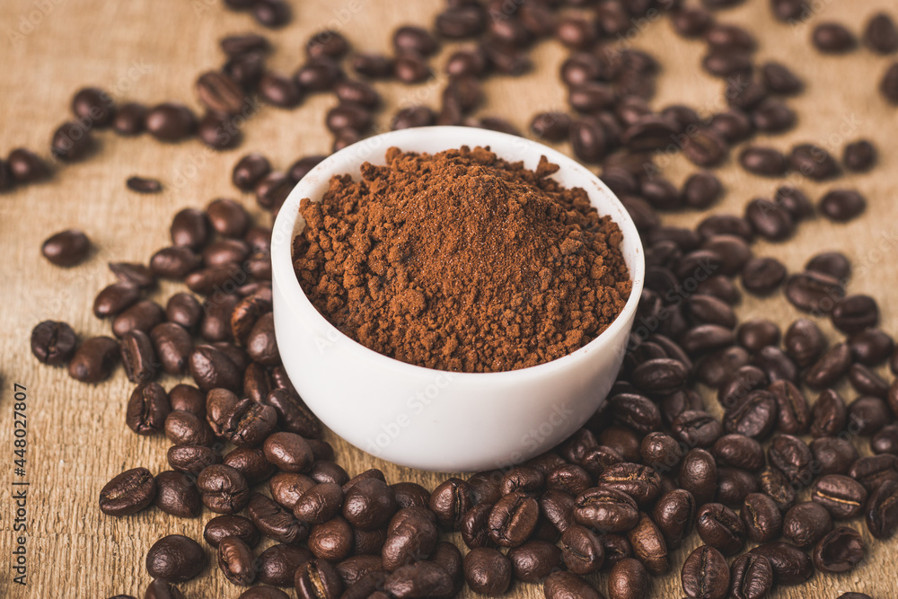 Coffee beans and powder with textured background stock image. Coffee beans and powder with textured background stock image.