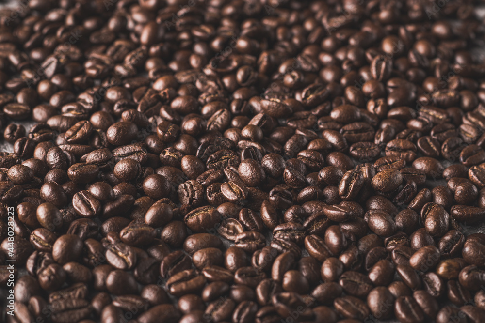 Obraz premium Coffee beans with textured background stock image.