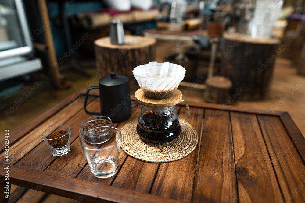drip coffee on a wooden table at home drip coffee on a wooden table at home
