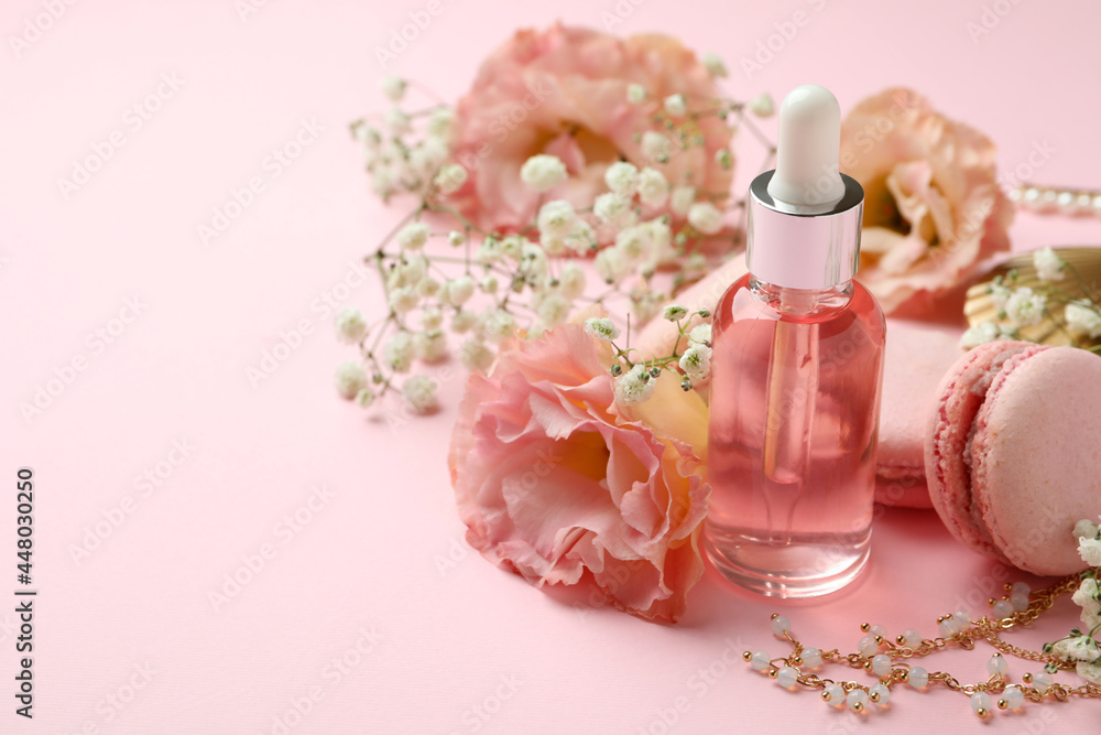 Female accessories and macaroons on pink background Female accessories and macaroons on pink background