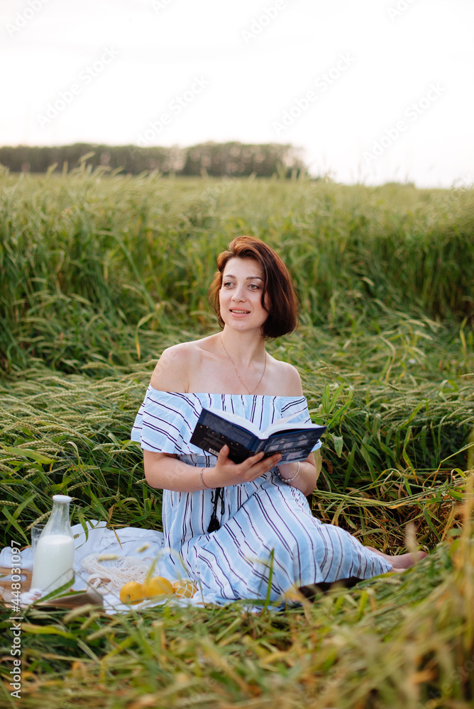 Beautiful young woman in summer in a wheat field Beautiful young woman in summer in a wheat field