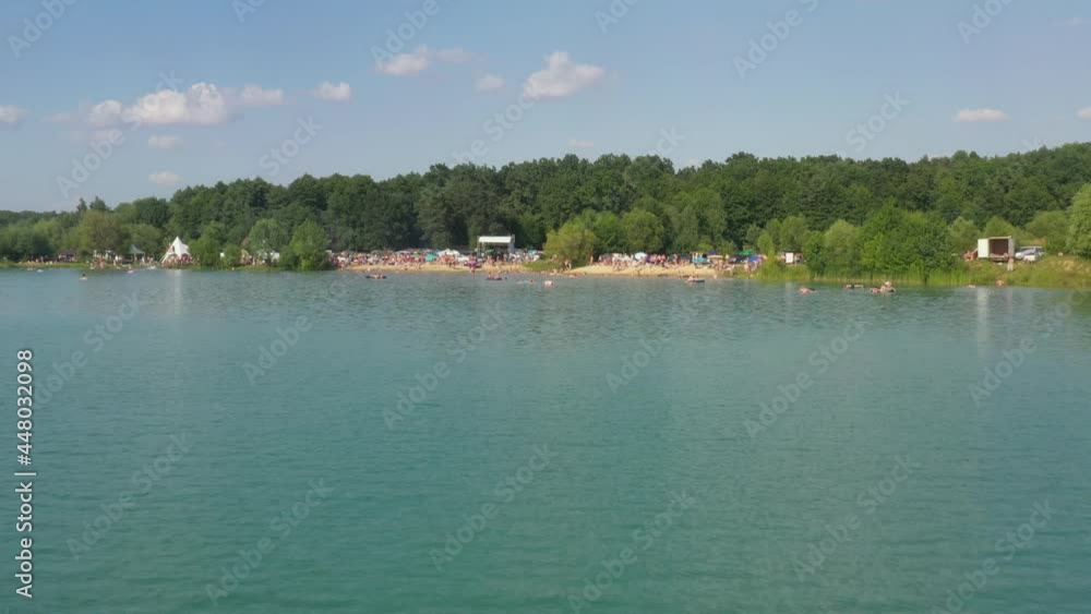 The flooded quarry is a resting place and a beach. Beach on a flooded quarry. An artificial beach in a flooded quarry. The flooded quarry is a resting place and a beach. Beach on a flooded quarry. An artificial beach in a flooded quarry.