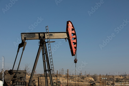 Daytime view of crude oil extraction in Bakersfield, California, USA.