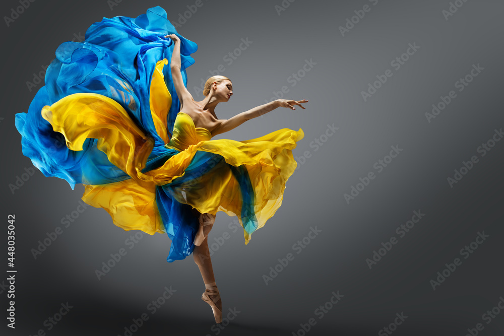 Fotografie, Obraz Beautiful Woman Ballet Dancer Jumping in Air in Colorful Fluttering Dress