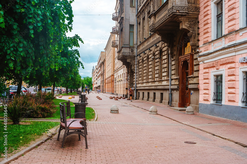 View of the facades of historical buildings on the street in the city center in summer. Saint Petersburg, Russia - 13 June 2021