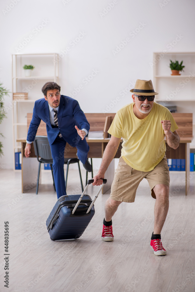 Old boss and young male employee in summer vacation concept Old boss and young male employee in summer vacation concept