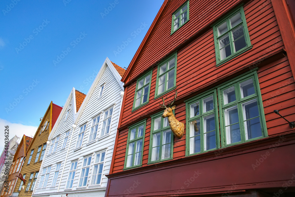 Colourful wooden houses of Bryggen the old wharf historic harbour district of Bergen, Norway. Its a Unesco World heritage listed and was rebuilt after being destroyed in a fire.