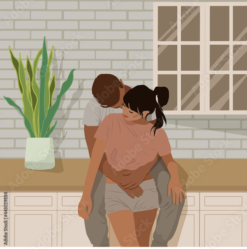 couple man and woman in love holding and kissing on the kitchen with plant in a pot