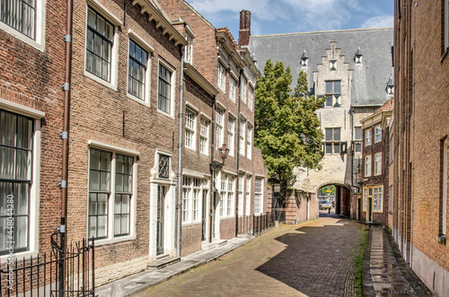 Middelburg, the Netherlands, July 25, 2021: picturesque street with brick facades in the old town on a sunny day