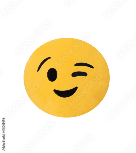 Cushion emoticon wink face isolated in white background