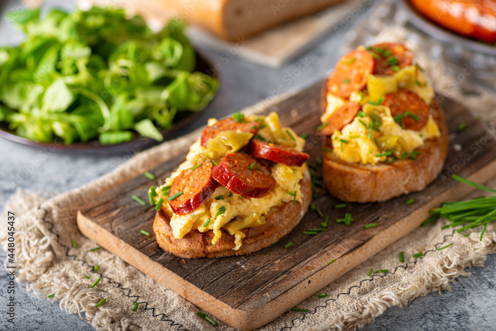 Scrambled eggs with sausage and herbs Scrambled eggs with sausage and herbs