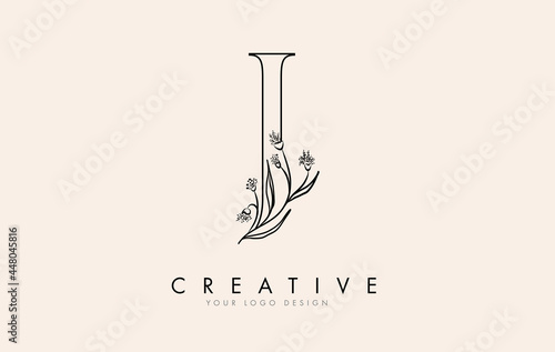 Black Outline J letter logo design with black flowers vector illustration.