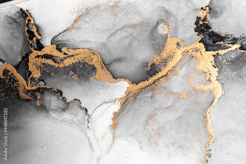 Black gold abstract background of marble liquid ink art painting on paper . I...