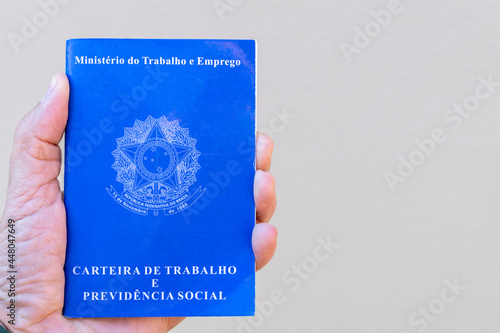 Brazilian Work Card. Hand holding work card with space for text. photo