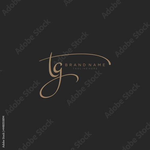 Letter TG gold handwritten logo design template. Black background.