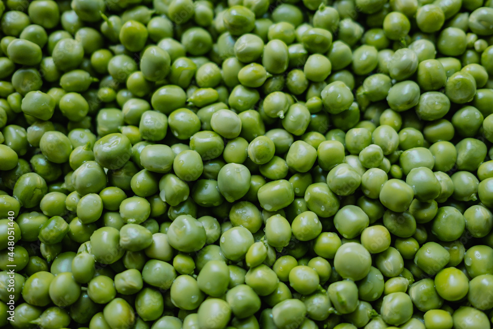 Lot of fresh beans. peas peeled on nature background. Green texture