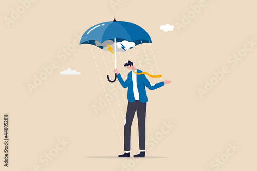 Business disaster or crisis, too many problems and failure, April fool or depression and mental health concept, soak businessman standing wet under fail umbrella in raining day.