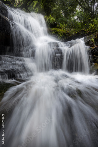 waterfall in the forest with many cascades