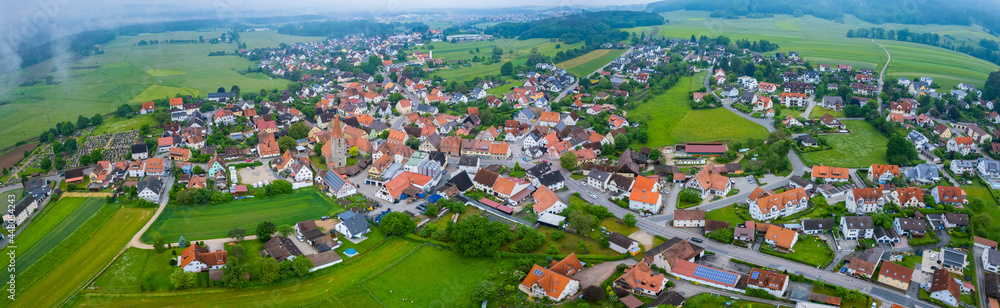 Aerial view of the village Kunreuth in Germany, on a cloudy afternoon in spring.
