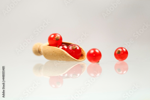 Red currants with white background