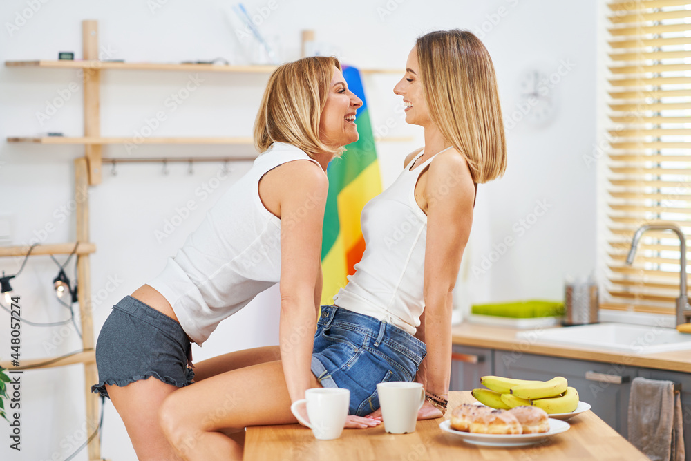 LGBT Lesbian couple love moments in the kitchen happiness concept