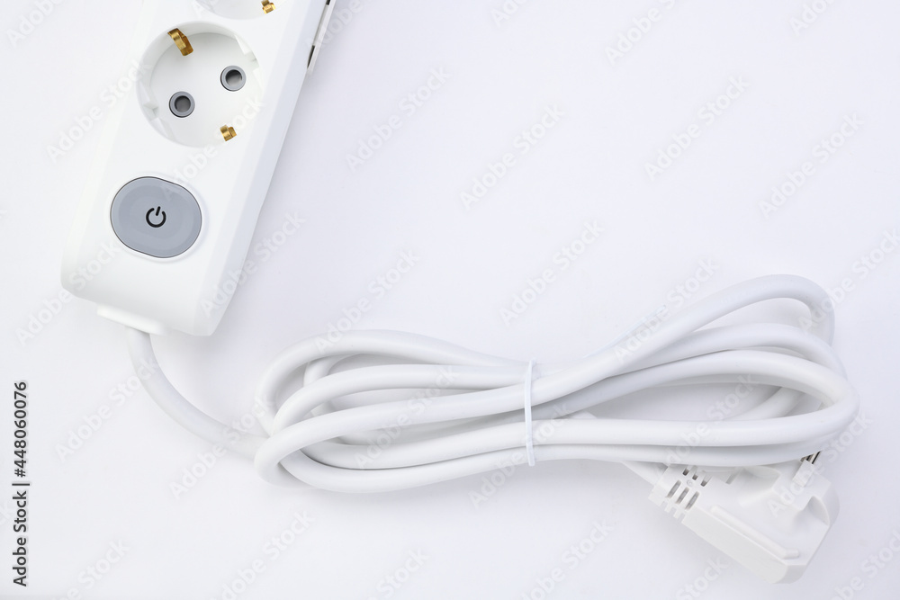White extension cord with three outlets. Power strip with switch for home or office. White extension cord with three outlets. Power strip with switch for home or office.