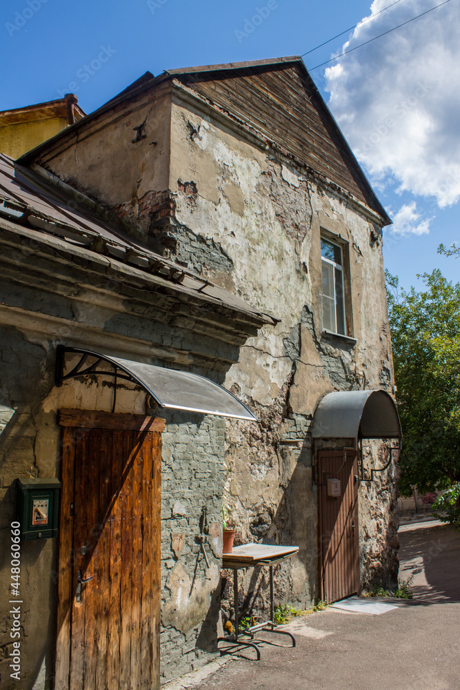 the oldest house with dilapidated stone walls and windows close-up on a sunny summer day in Vyborg Russia the oldest house with dilapidated stone walls and windows close-up on a sunny summer day in Vyborg Russia