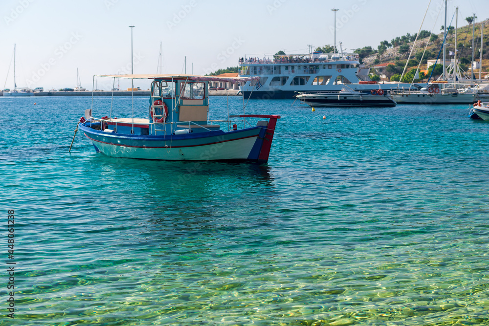 Fototapeta premium boats sway on the turquoise waves of the Ionian sea of Greece in sunny weather