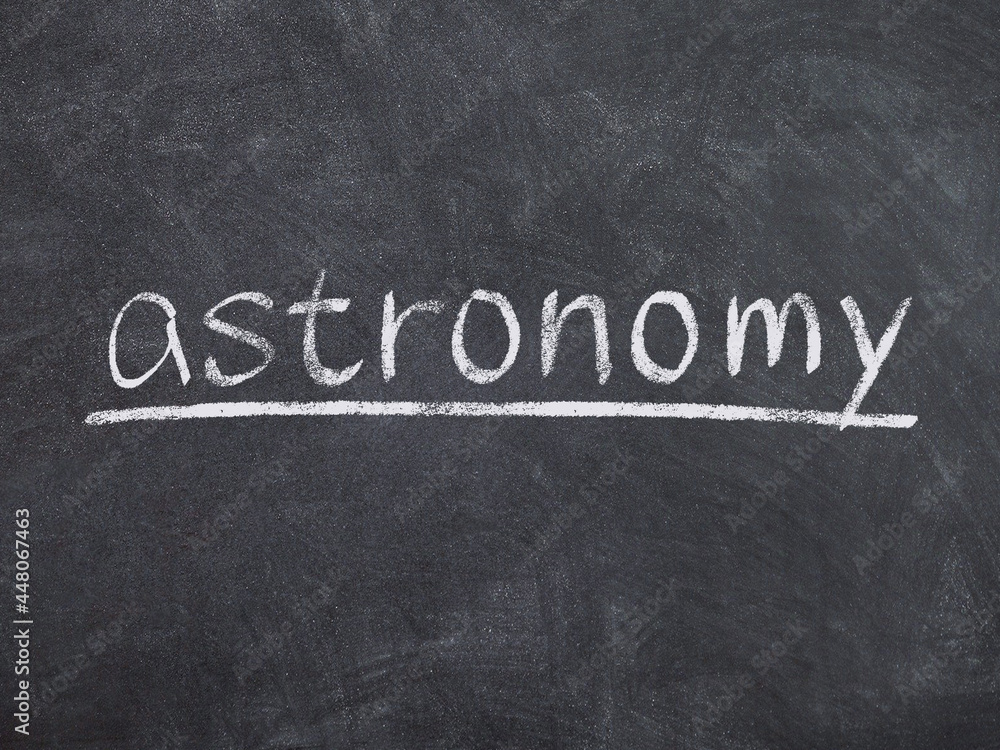 Fototapeta premium astronomy concept word on blackboard background