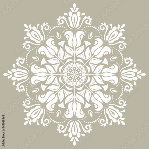 Elegant vintage ornament in classic style. Abstract traditional pattern with oriental elements. Classic round white vintage pattern