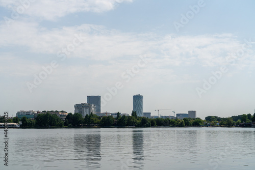 buildings in the city behind the lake