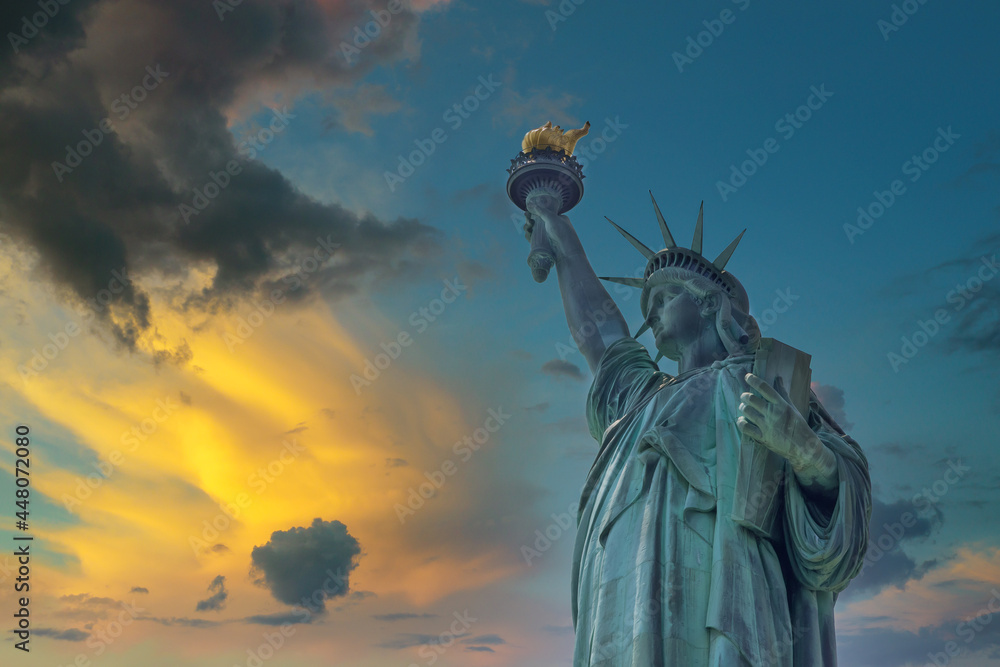 Fototapeta premium Aerial view of the Statue of Liberty at sunset in Manhattan New York City, United States