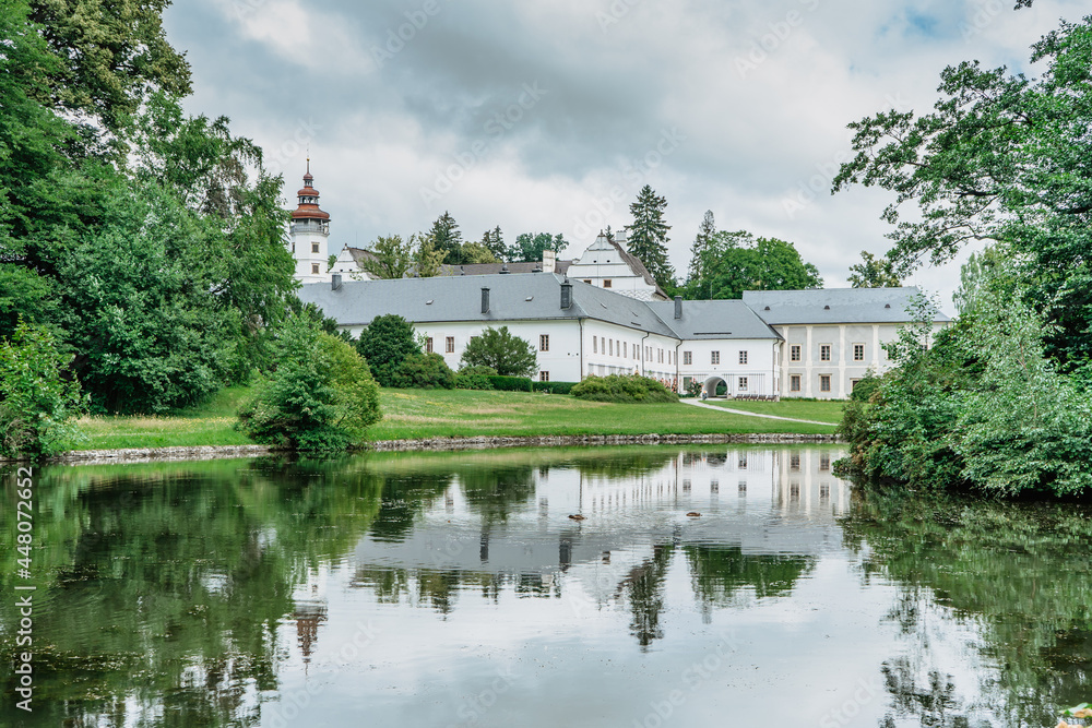 Velke Losiny Castle in Czech spa town,East Bohemia,Jeseniky Mountains,Czech Republic.Romantic Renaissance chateau with sgraffito decoration reflected in water,surrounded by beautiful park.Travel scene