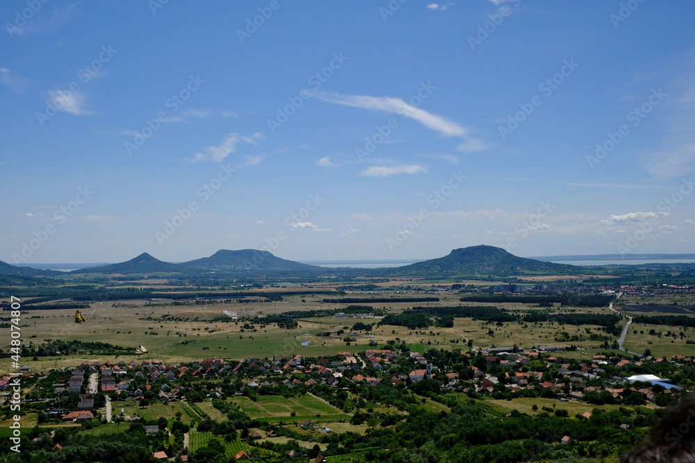 panoramic view of volcanic hills with village
