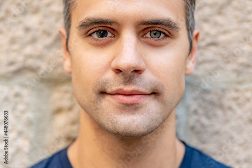 Close up portrait of latin man with heterochromia photo